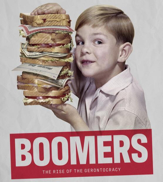 A picture of Tom Nicholas holding some books.